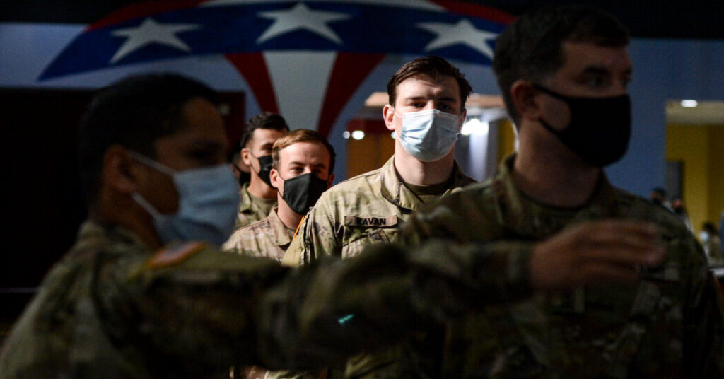 A federal judge blocks the Defense Dept. from punishing Navy forces who refuse the vaccine.