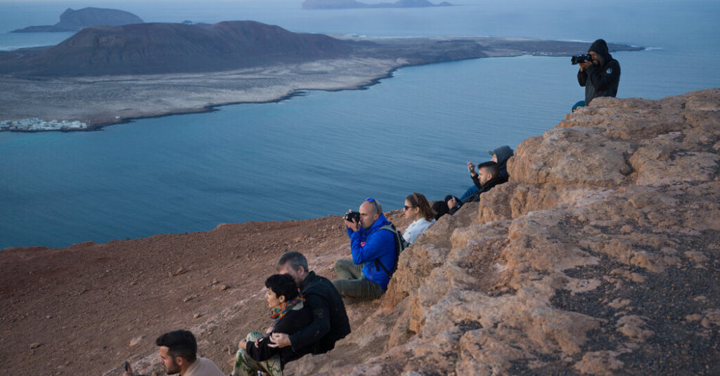 undeterred by omicron tourists seek sun in a welcoming spain