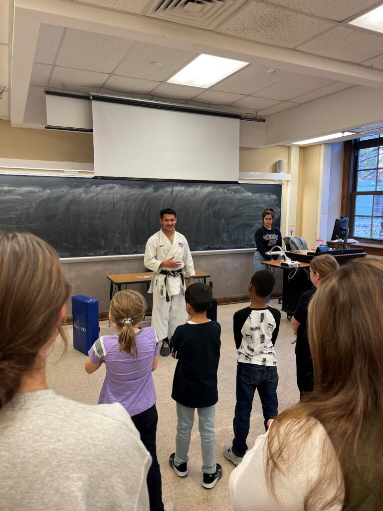 Rickyjon Balgenorth teaching karate to elementary school students with the Purdue Karate Club.