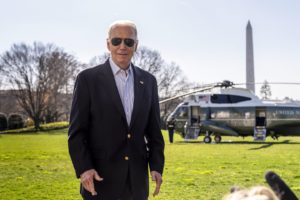 Biden's aides flank him to Marine One to block cameras from catching him shuffling