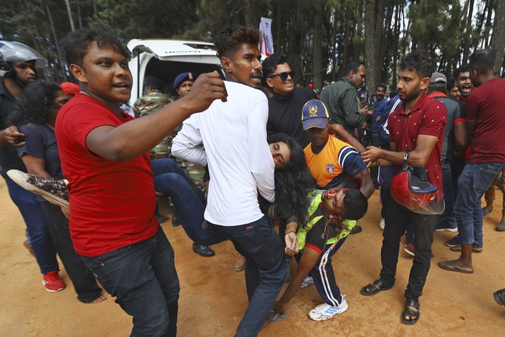 Race car in Sri Lanka veers off track killing 7 people and injuring 20, officials say