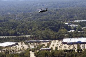 Biden in helicopter views flattened buildings, submerged houses in North Carolina